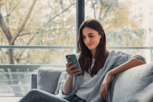Pet-insurance-quote-woman-looking-at-phone