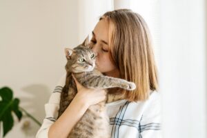 Pet-insurance-reviews-woman-kissing-cat